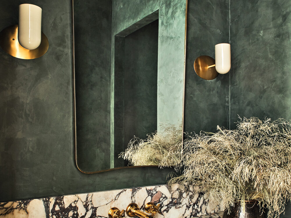 Behind This Moody Green Bathroom That’s Dramatic And Daring