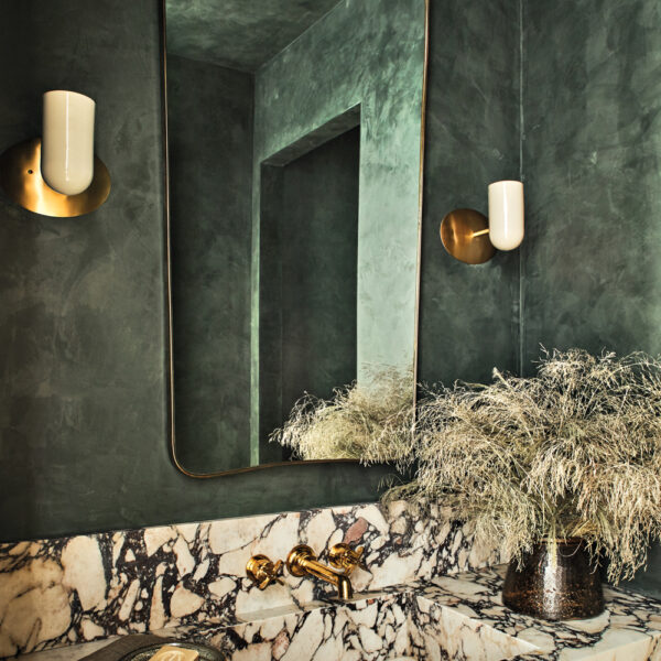 Behind This Moody Green Bathroom That’s Dramatic And Daring