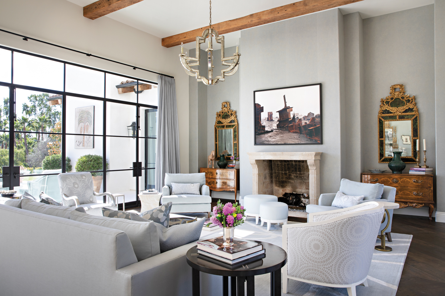 living room fireplace with chandelier,...