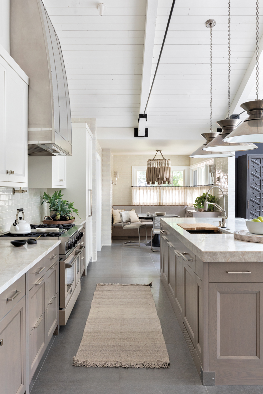 A white kitchen with gray...
