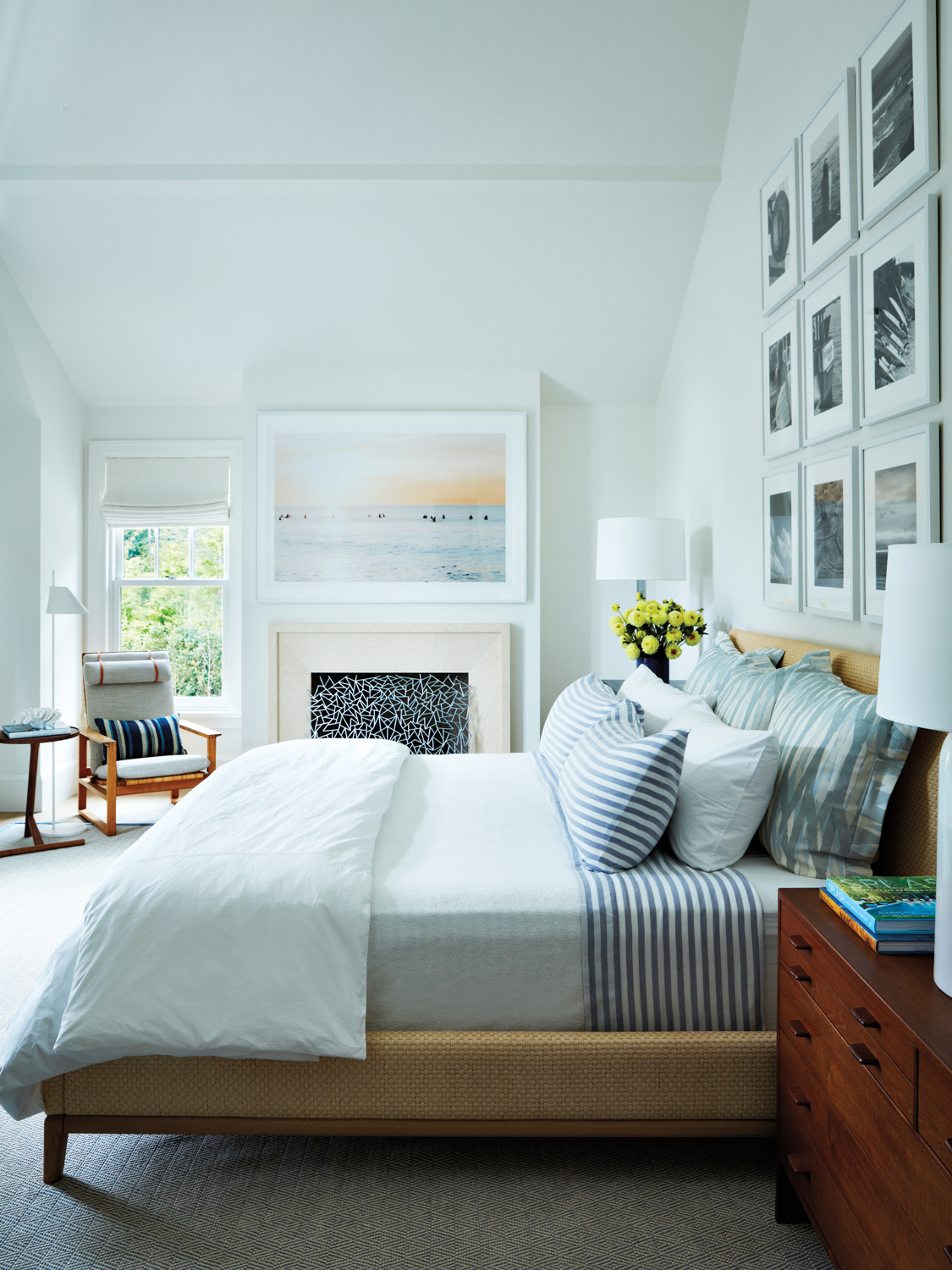 primary bedroom with light, beachy-toned...
