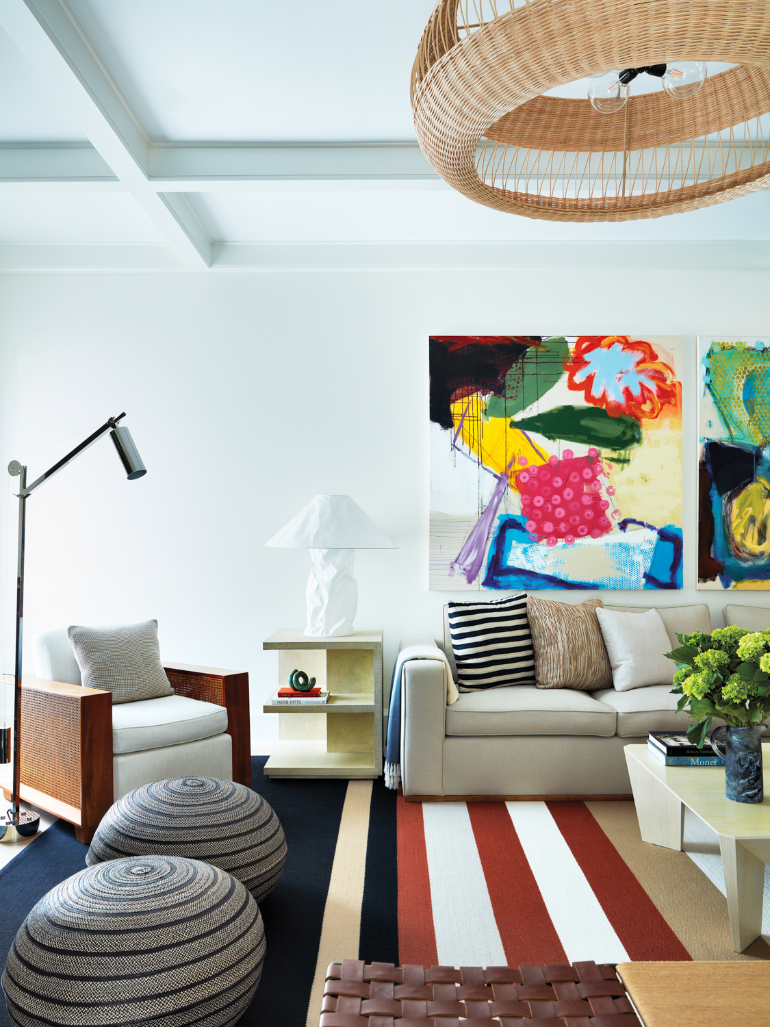 modern hamptons living room with vibrant wall art and patterned carpet