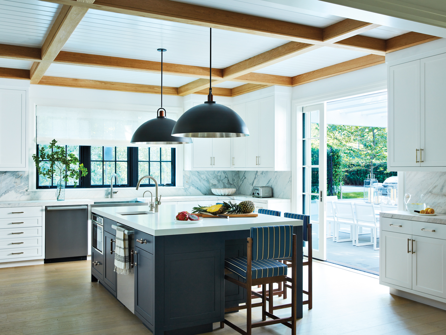 modern kitchen with quartz-topped island...