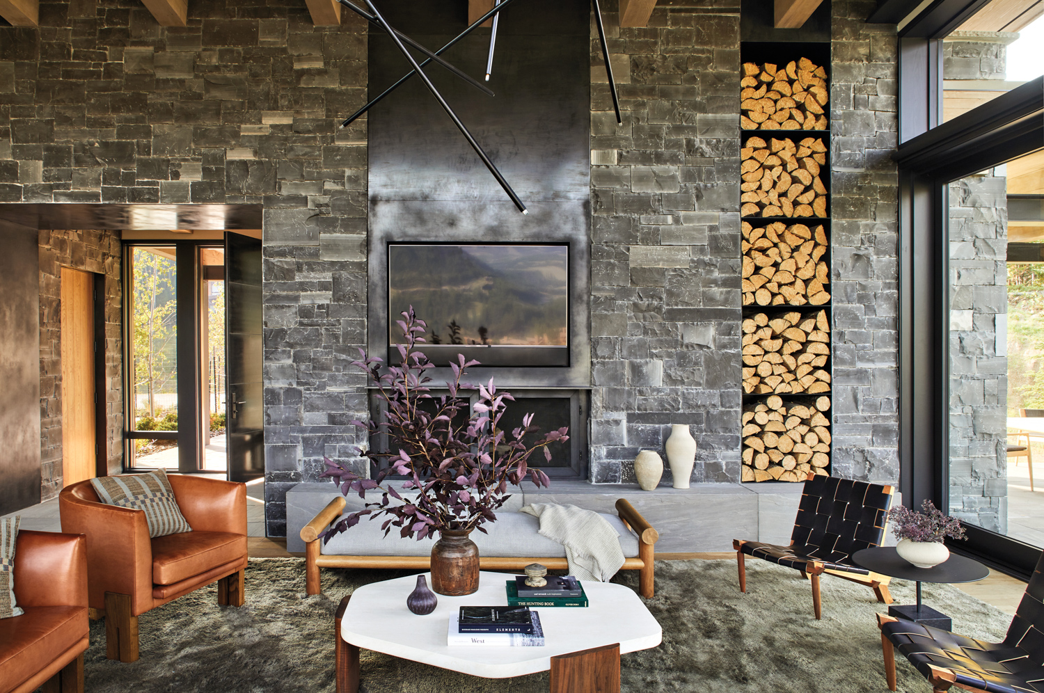 A fireplace is made of stone and metal.