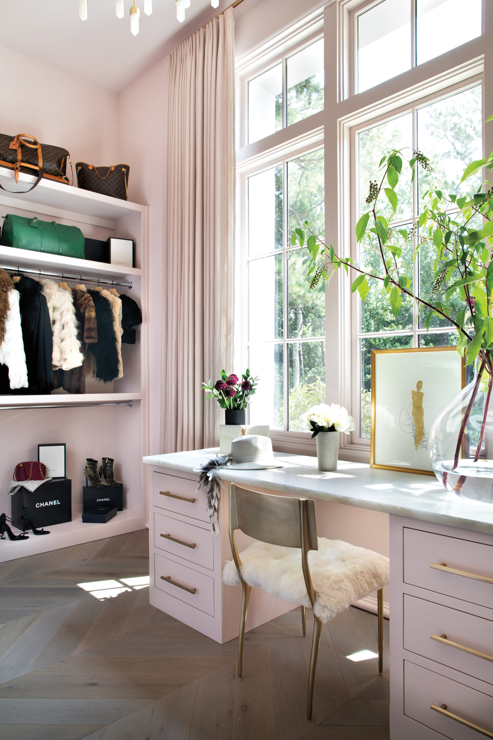 Barbiecore interior design closet with a matching vanity and brass vanity chair