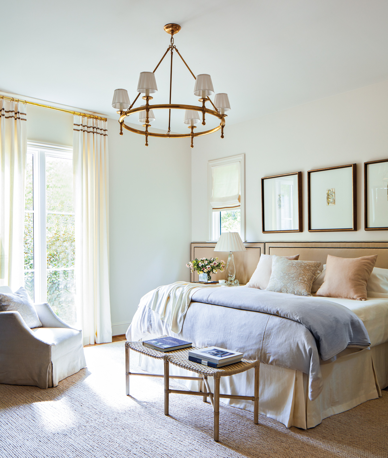 A neutral bedroom with a...
