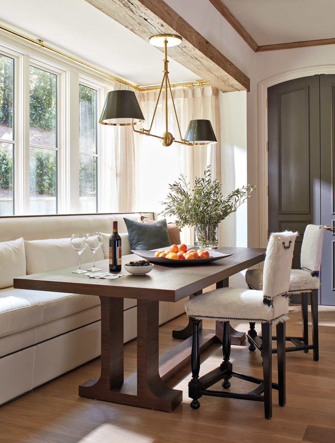 Sunlit dining nook featuring a...