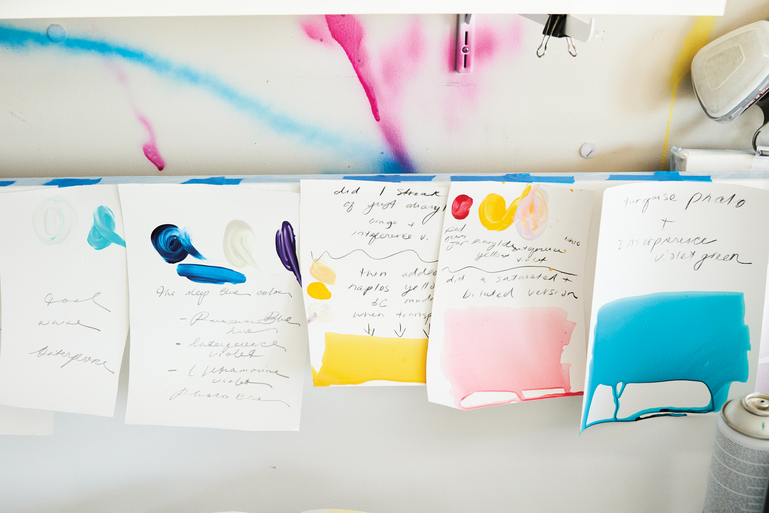 Notes and color swatches on sheets of watercolor paper