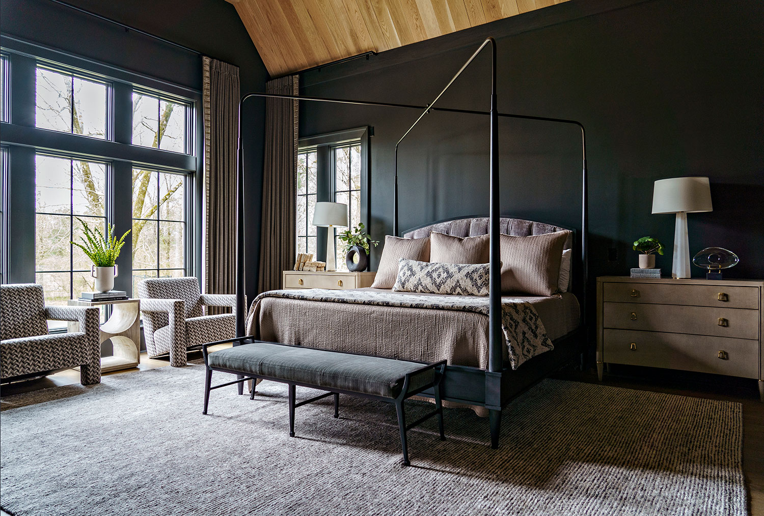 dark moody bedroom illustrates that charcoals and browns are trending for 2023