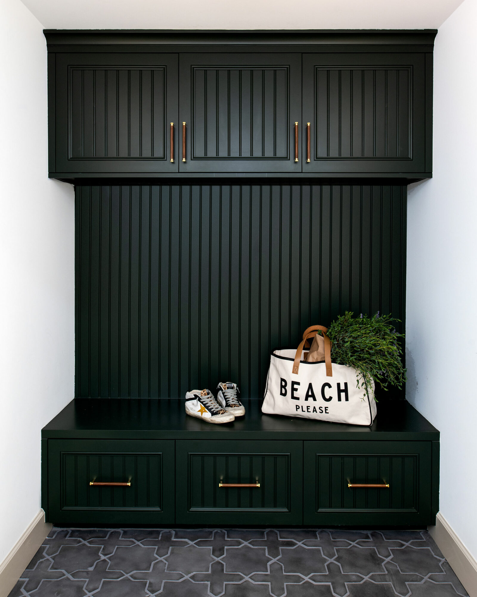 best colors for small spaces include a dark green like in this mudroom by hillary stamm