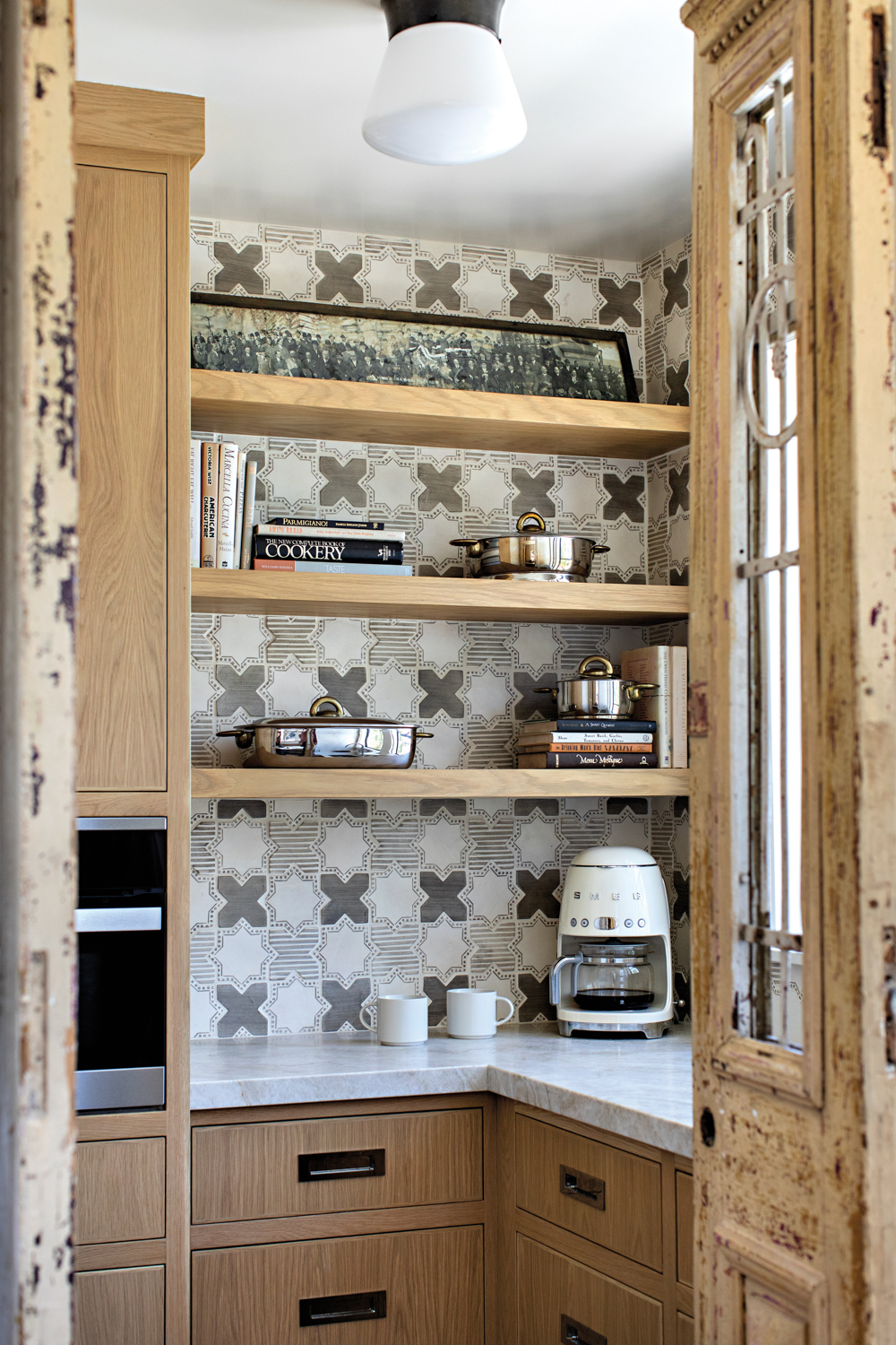 Pantry with hand-painted terra-cotta tiles...