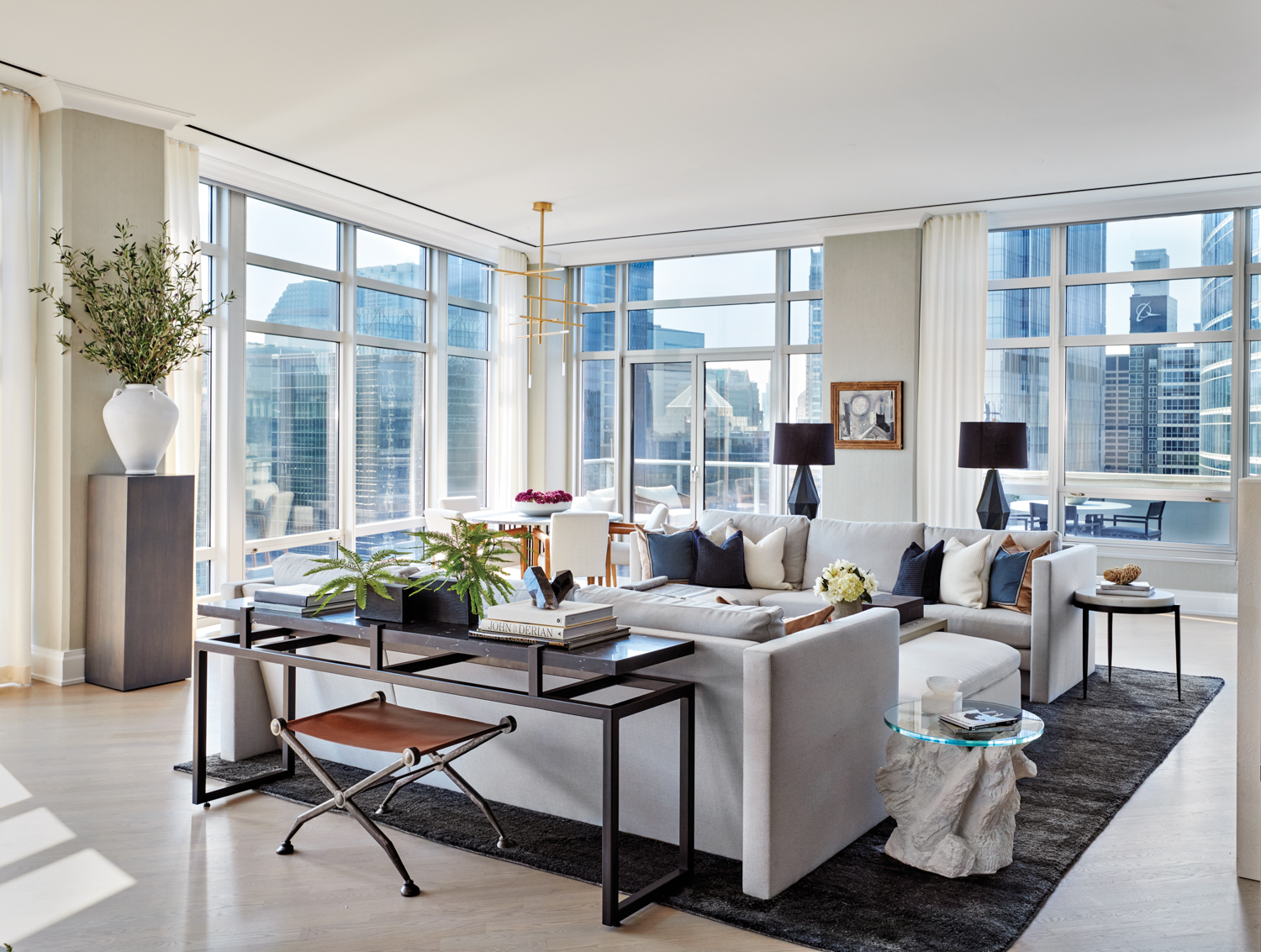 living room with floor-to-ceiling windows...