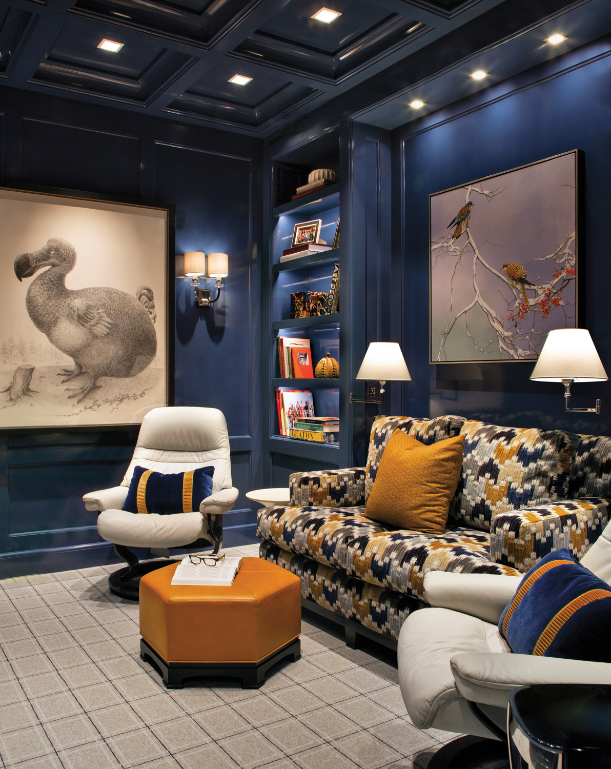 Den with deep navy walls, a patterned sofa, white armchairs and a large painting of a dodo bird