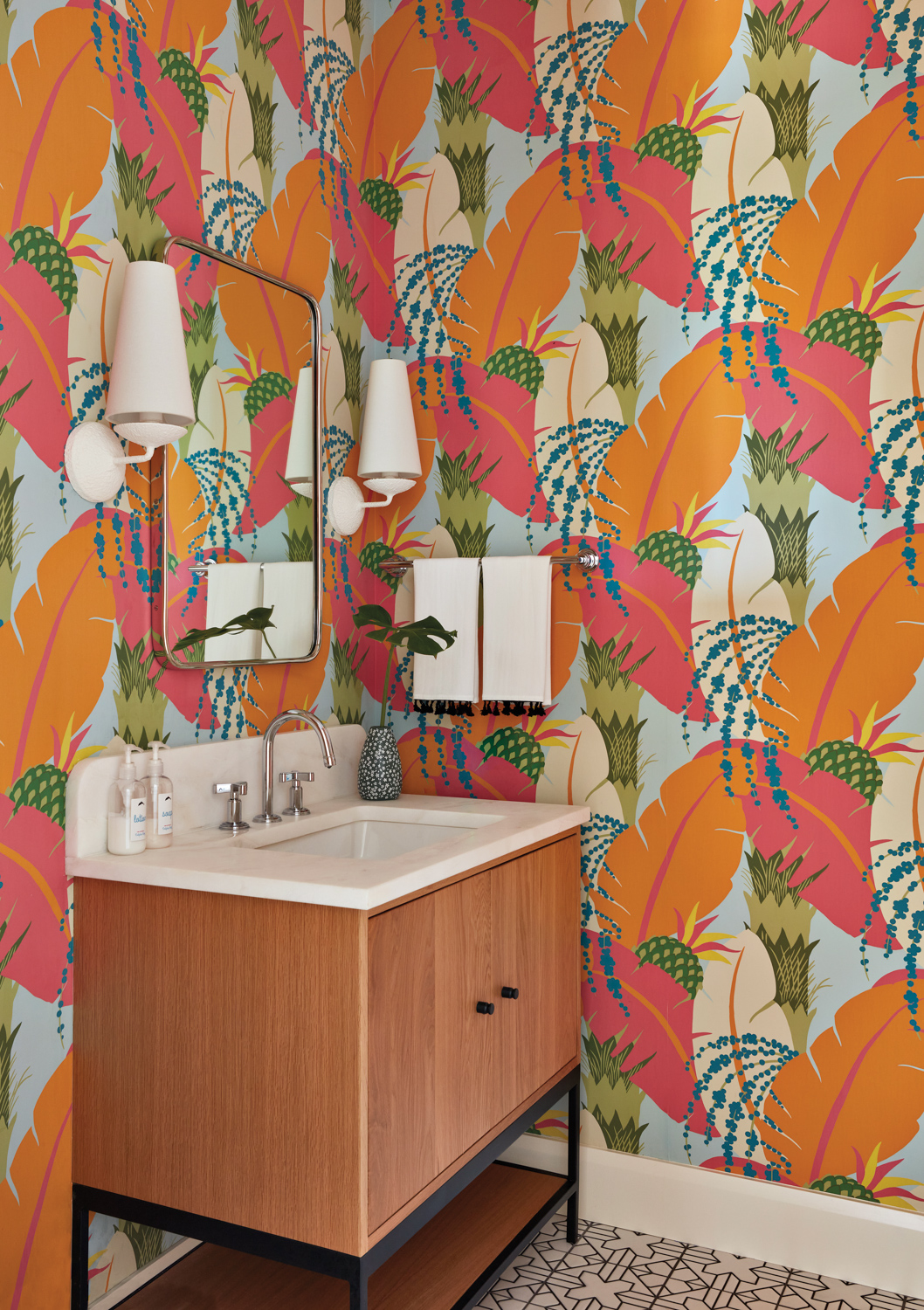 powder room with orange-and-pink palm...