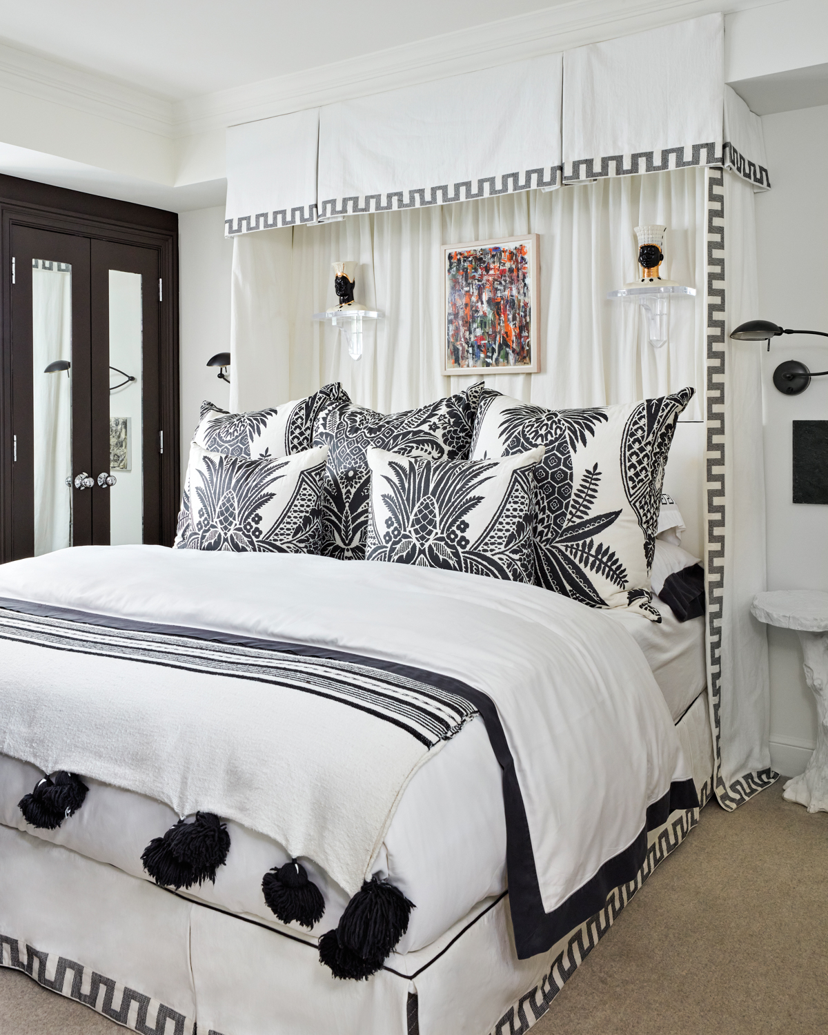 guest bedroom with black-and-white bed,...