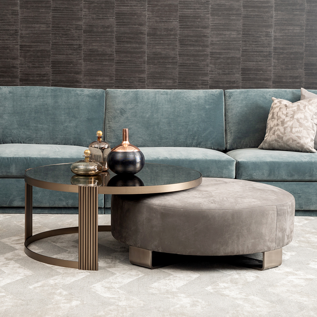 cliff young teal couch and gold coffee table with gray ottoman