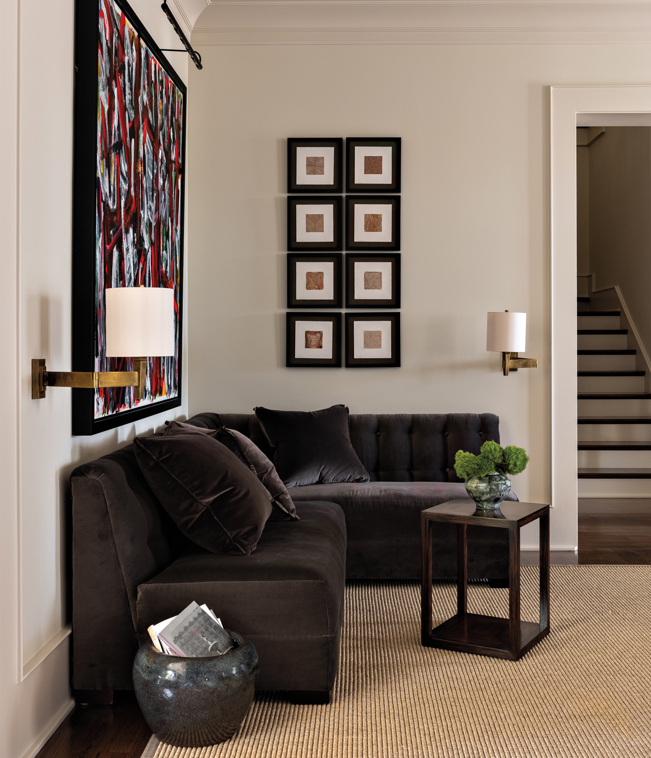 Corner of room featuring velvet-upholstered...