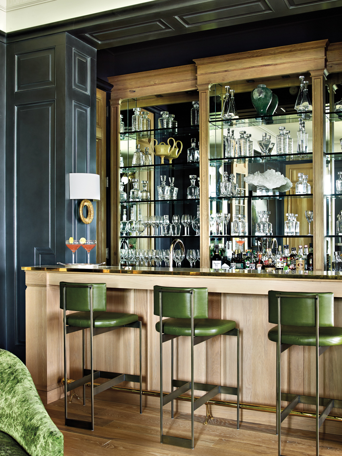 Bar with mirrored backsplash, green...
