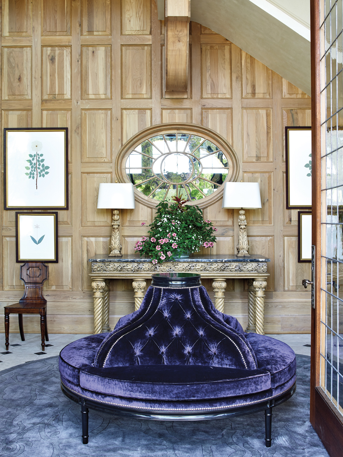 Entryway with paneled walls, round...