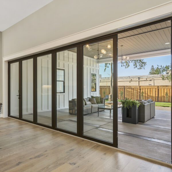 sliding glass doors open to patio by Panoramic Doors