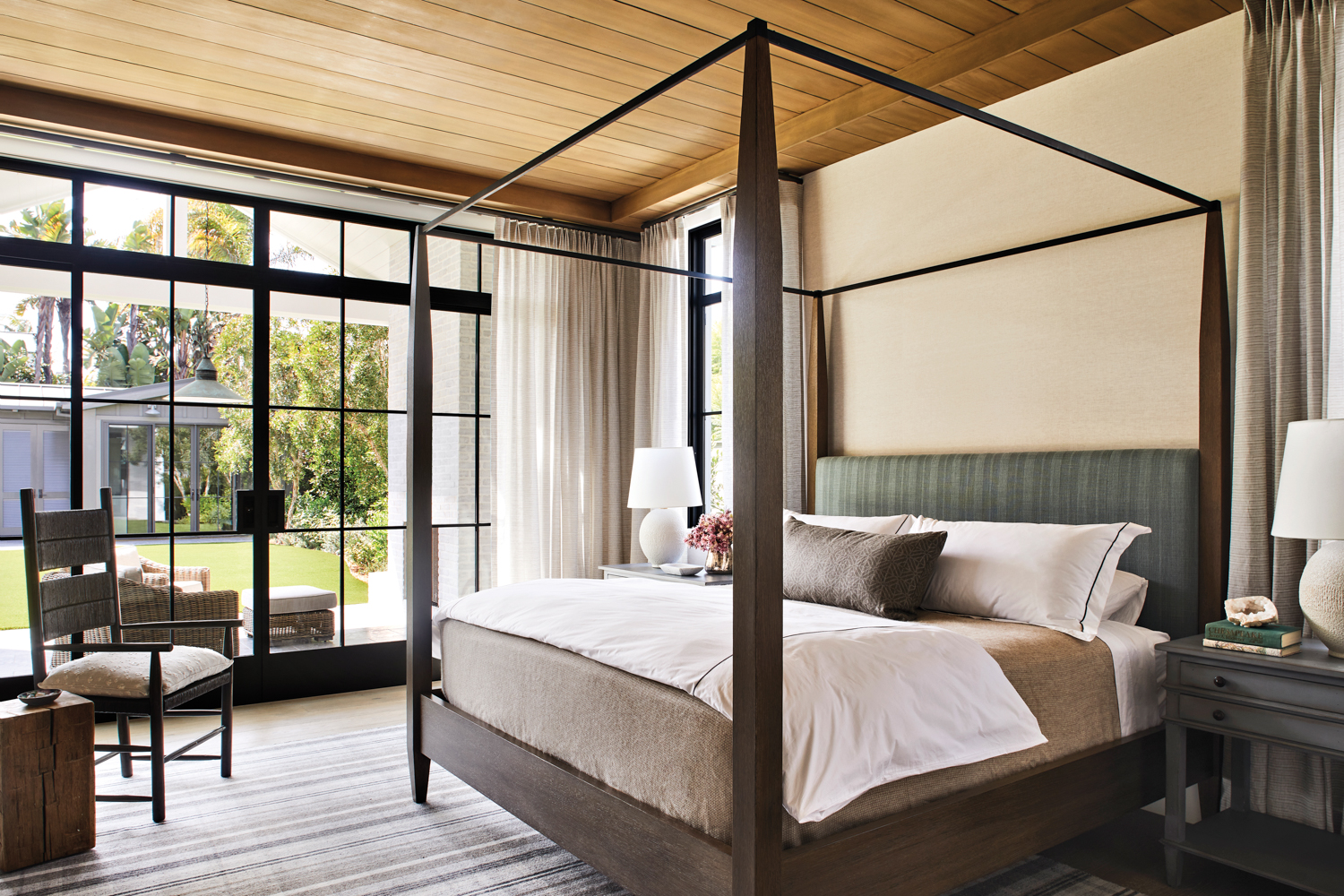 Bedroom with stained-wood ceiling, steel-framed...