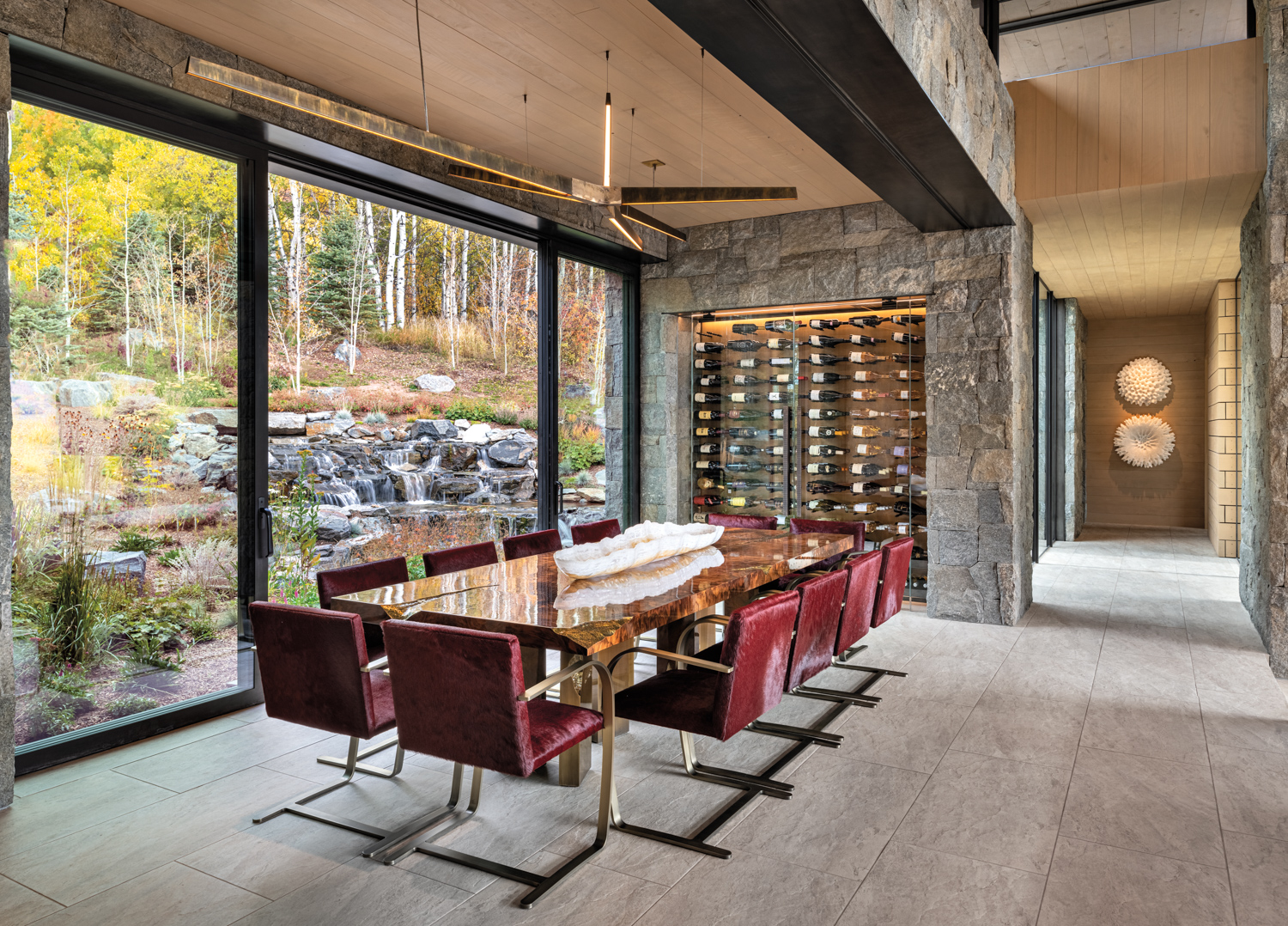 Dining room with granite wall,...