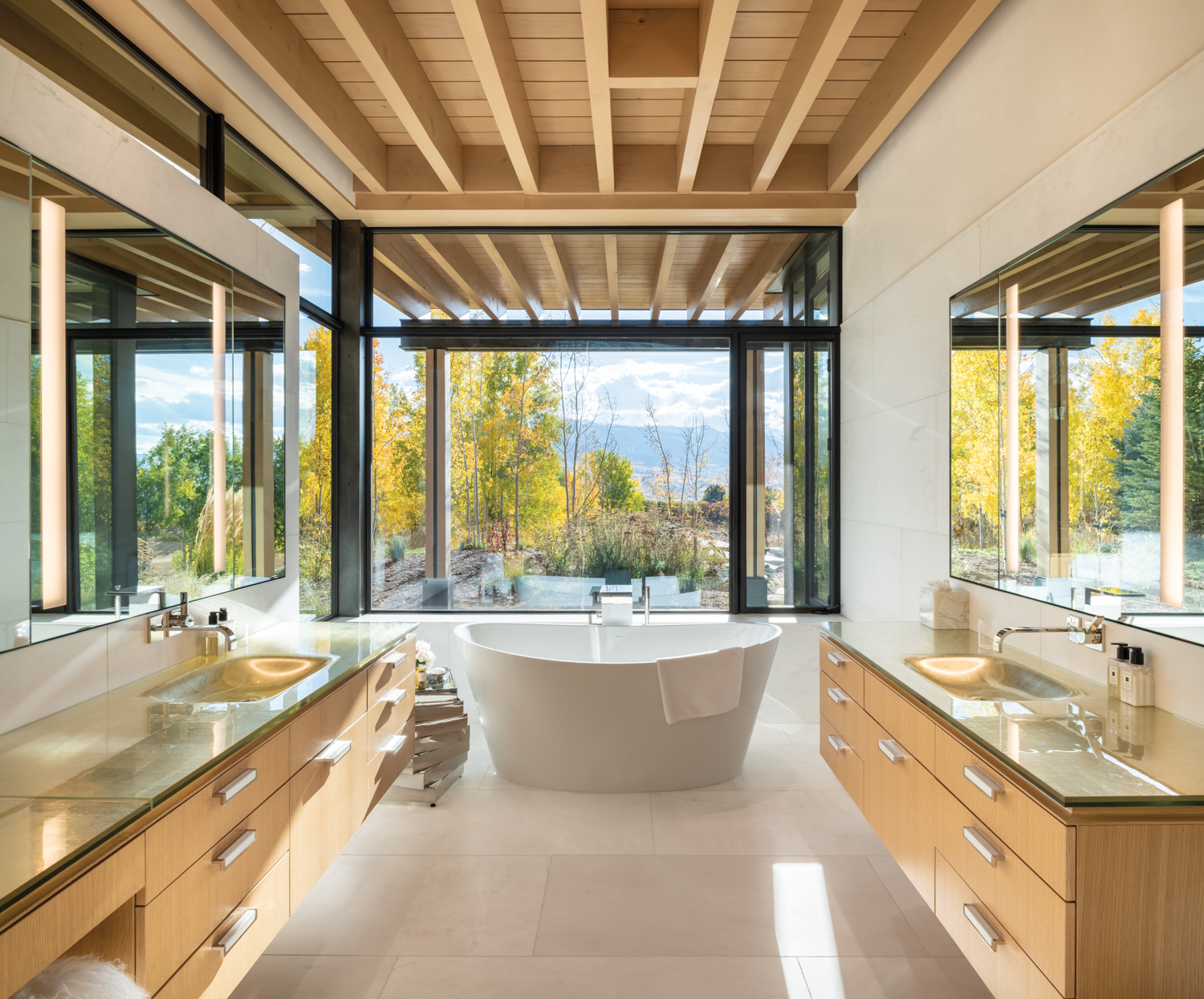 Bathroom with slatted-wood ceilings, window...