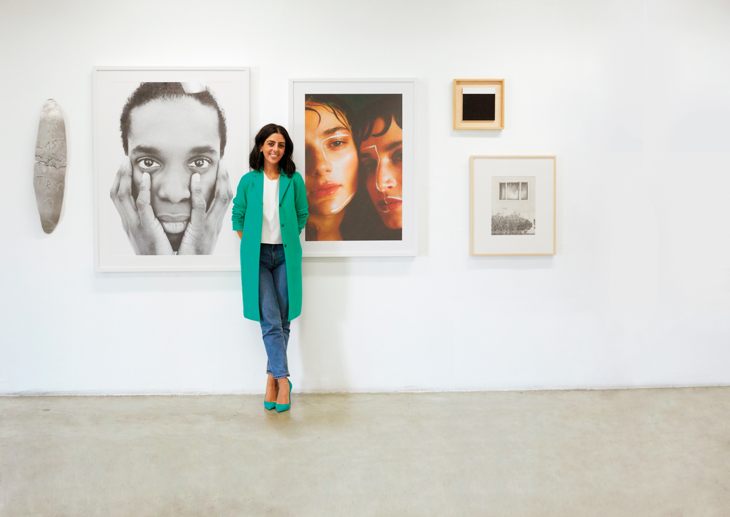 chelsea Neman Nassib in front of photograph exhibit 