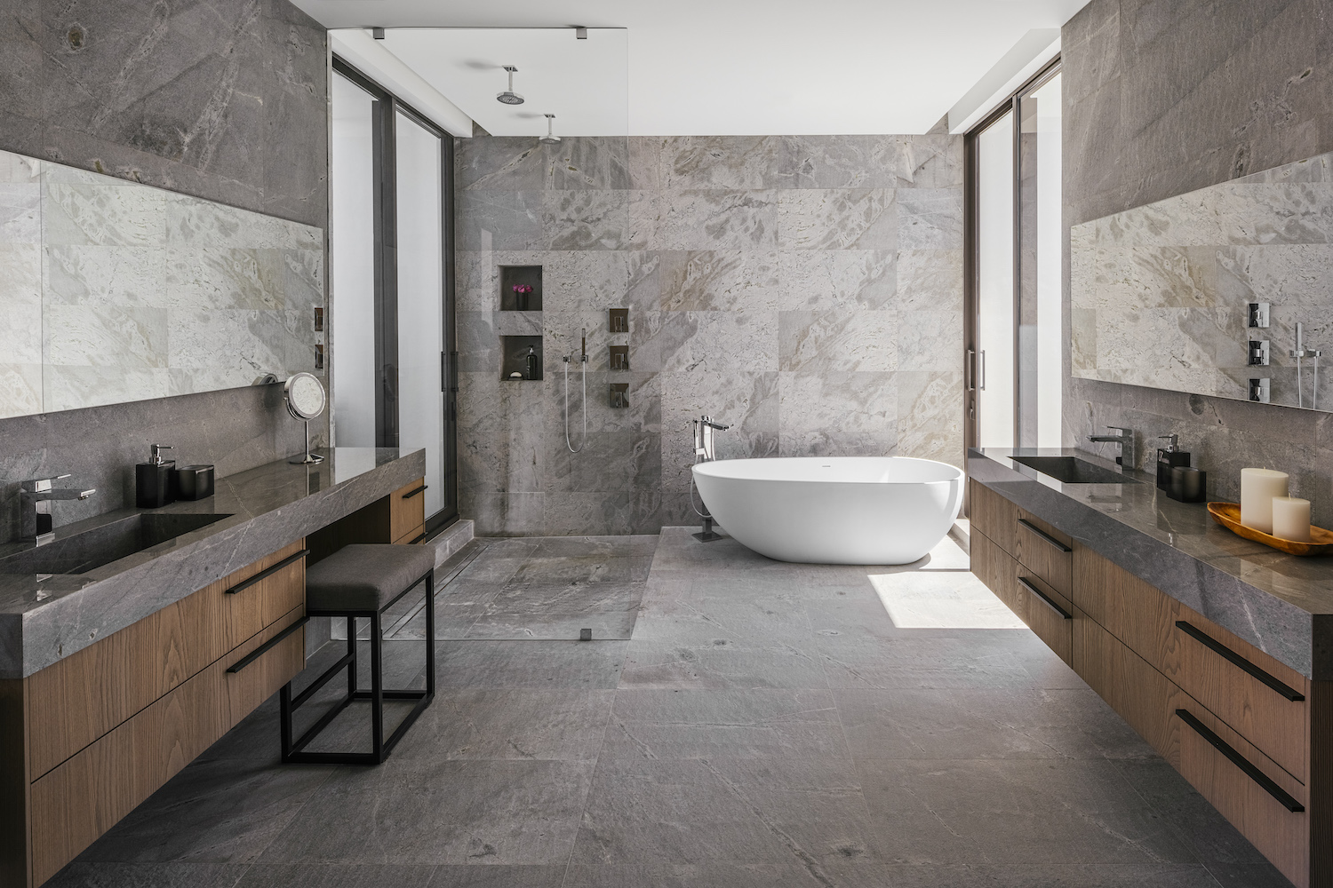 bathroom with large format tile and freestanding tub