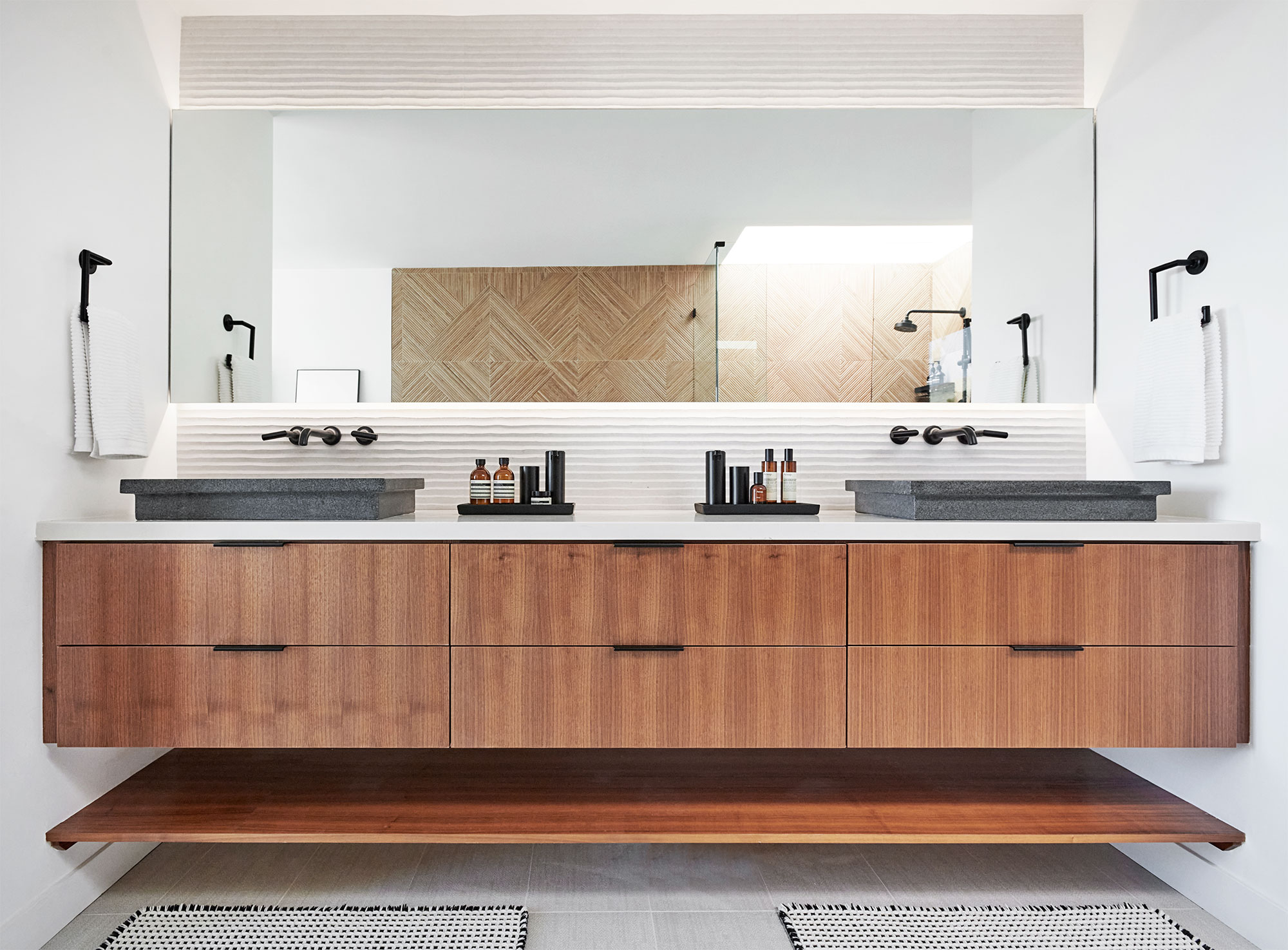 neutral spa-like bathroom with wood vanity 