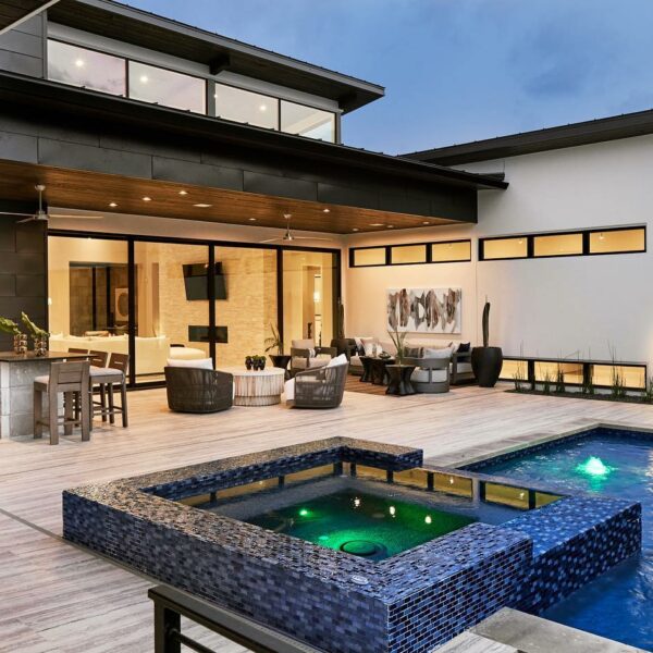Backyard with built in pool and jacuzzi.