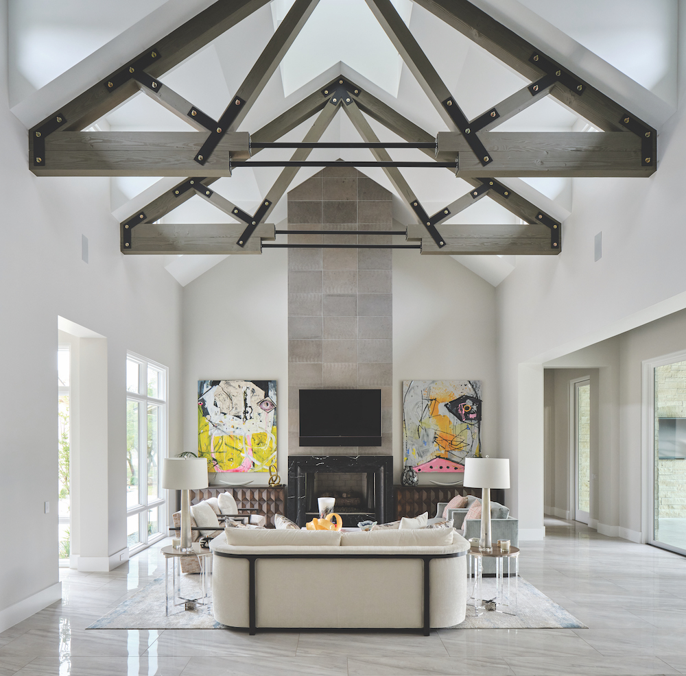 Vaulted ceilings with wood beam features in this living room.