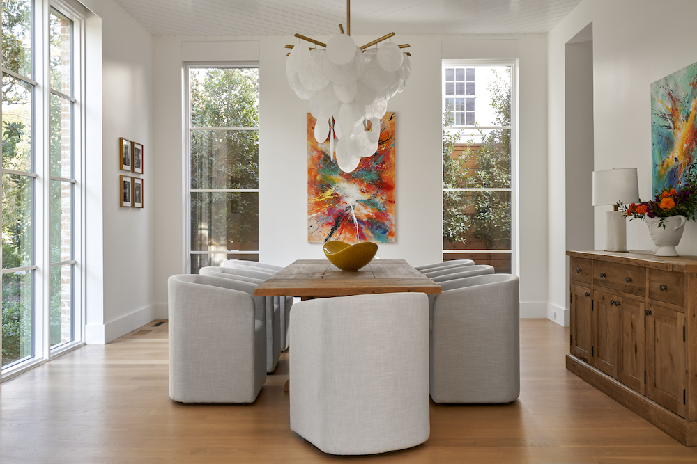 clean, contemporary dining room with neutral palate and featured artwork.