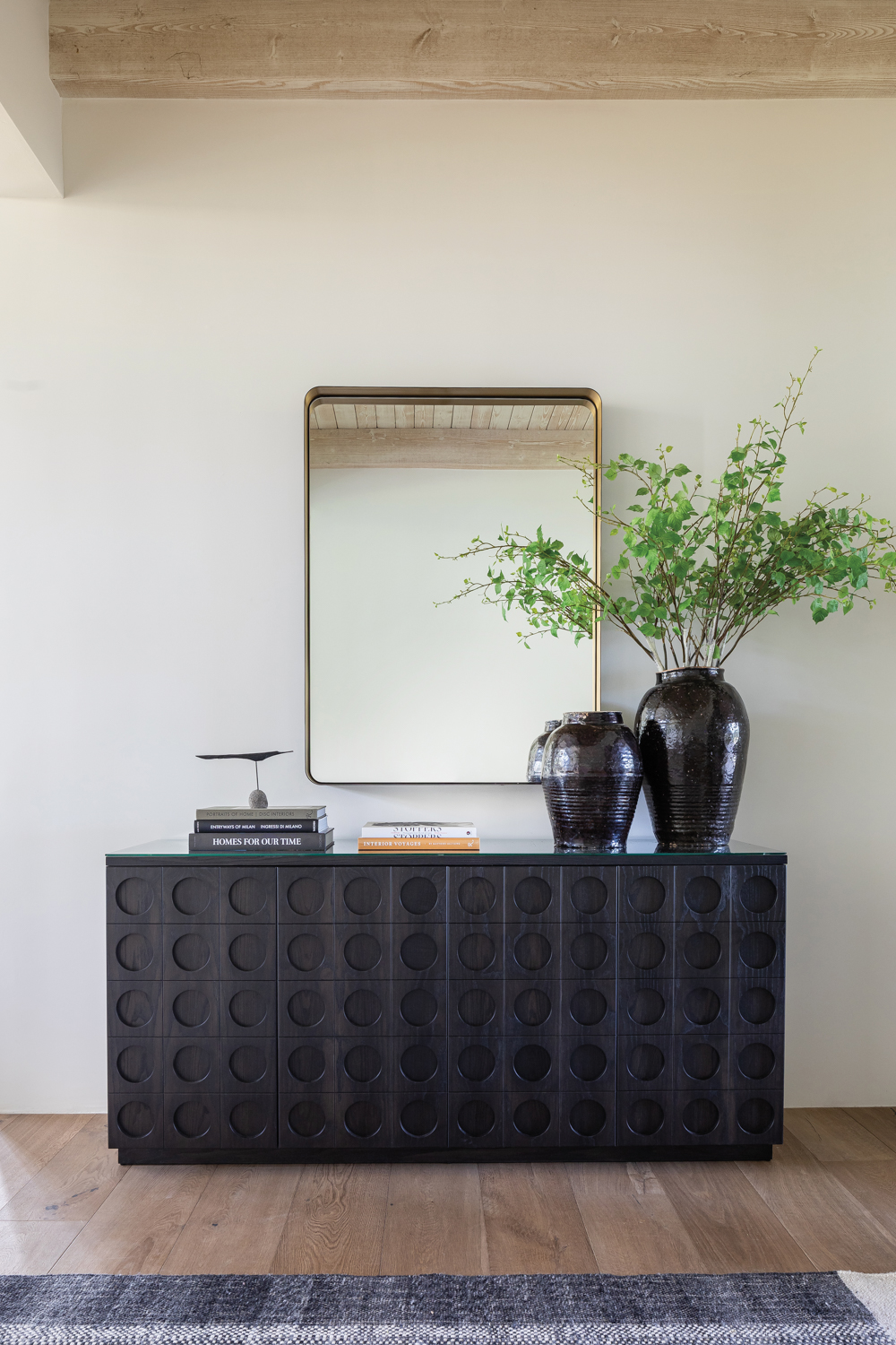 foyer with black console with...