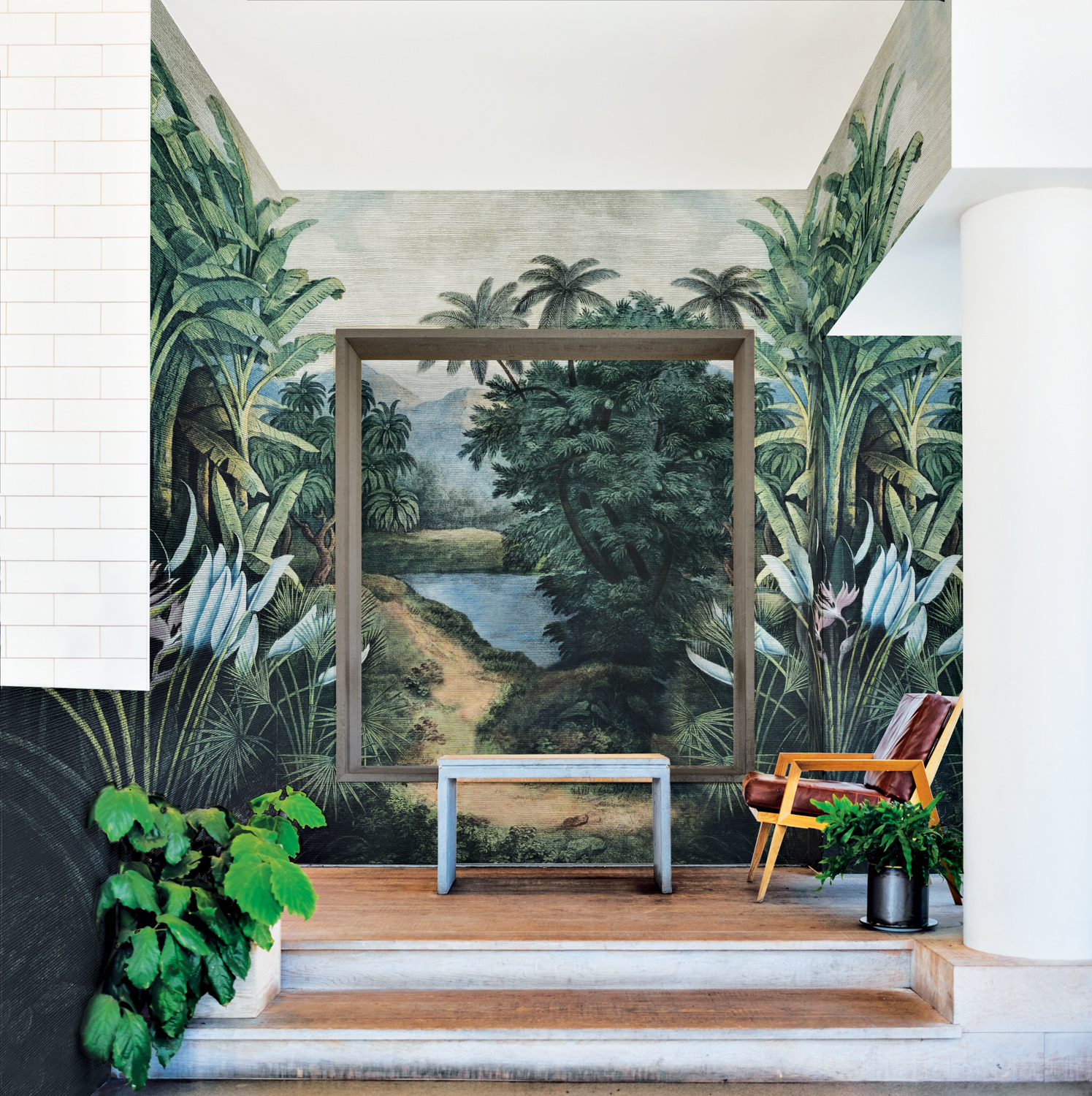 Room showcasing a wallcovering of a painted tropical landscape