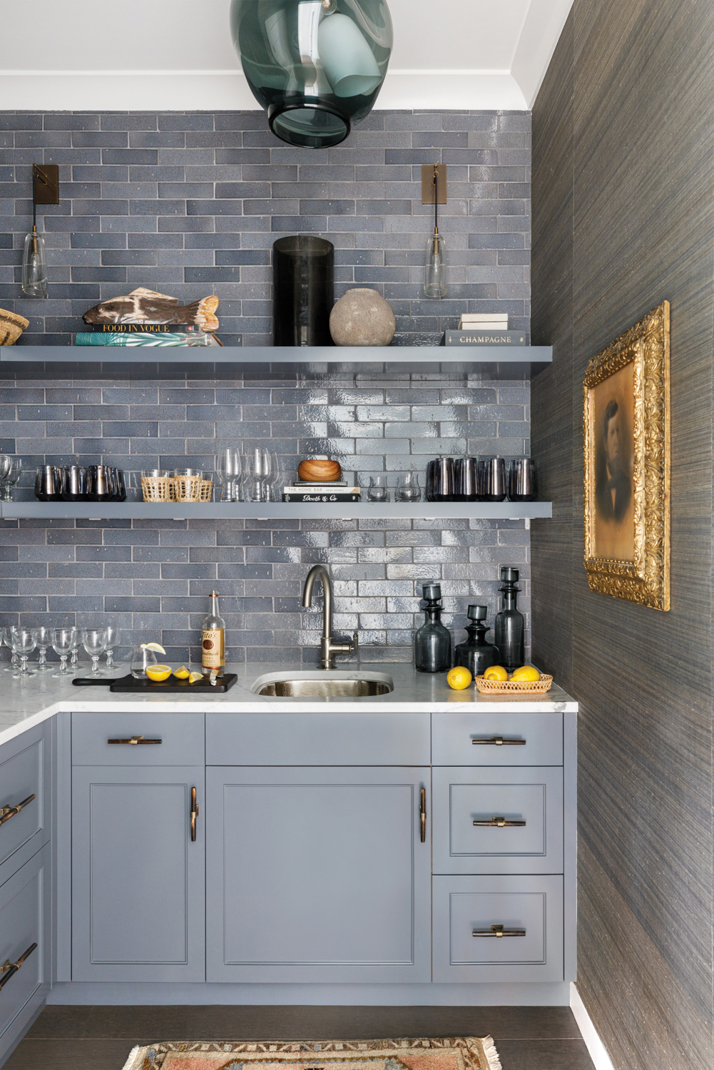 bar with gray-blue cabinetry and...