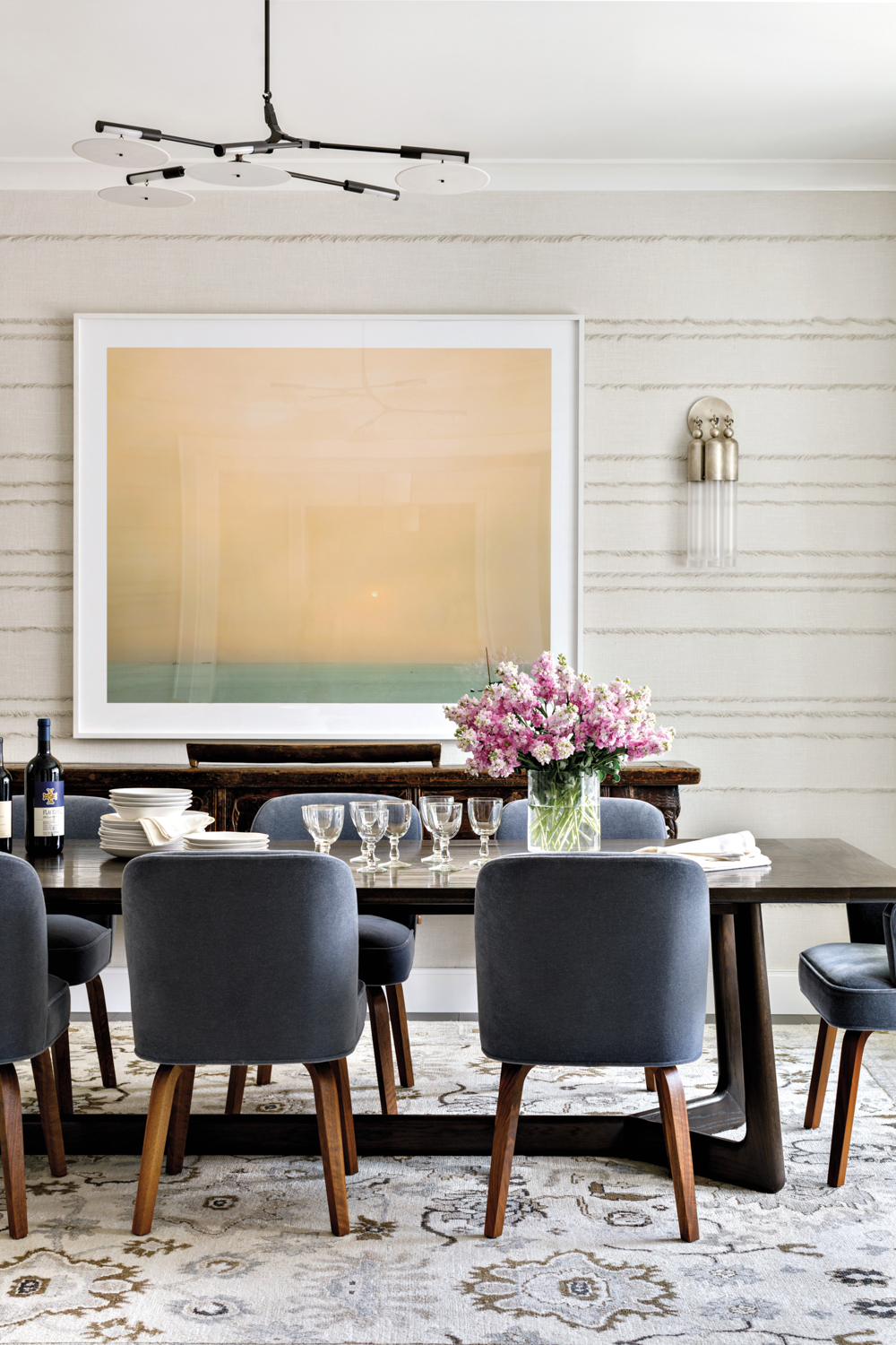 dining room with blue upholstered...