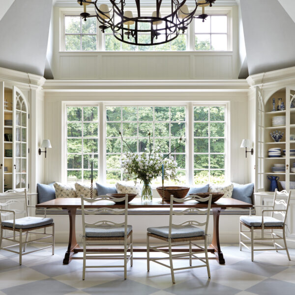 A Majestic Connecticut Home Masters The Art Of A Warm Welcome blue and cream breakfast area with iron chandelier