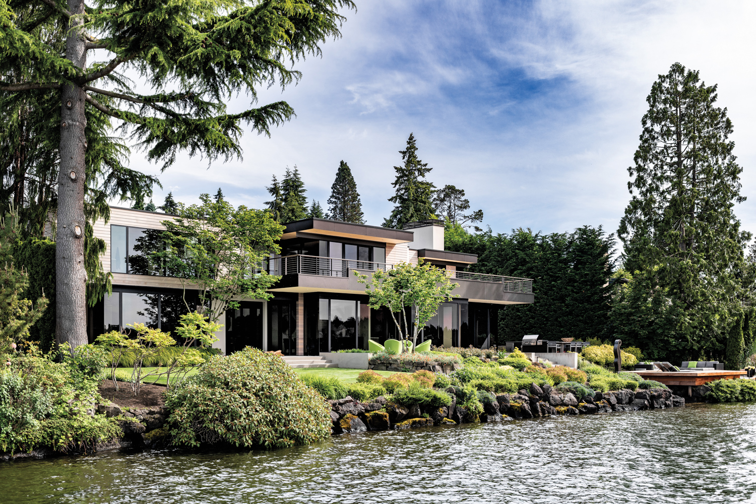 A Mercer Island home perches on the shore by the water.