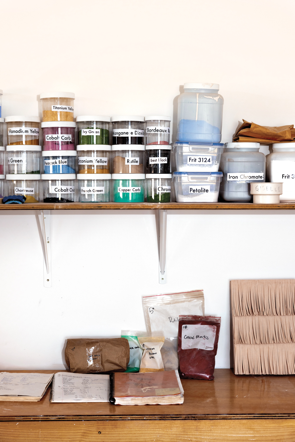Pigments are stacked in Giselle Hicks' studio.
