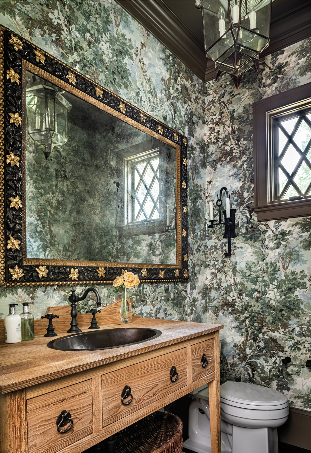 Green floral bathroom with honey-colored...