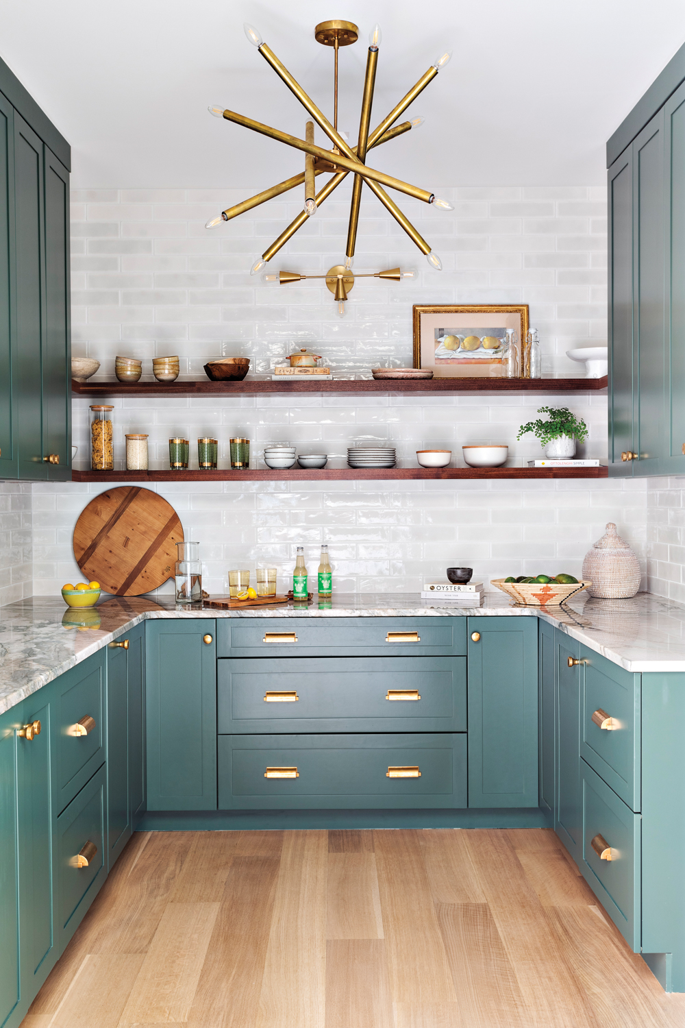 Teal pantry with brass hardware,...