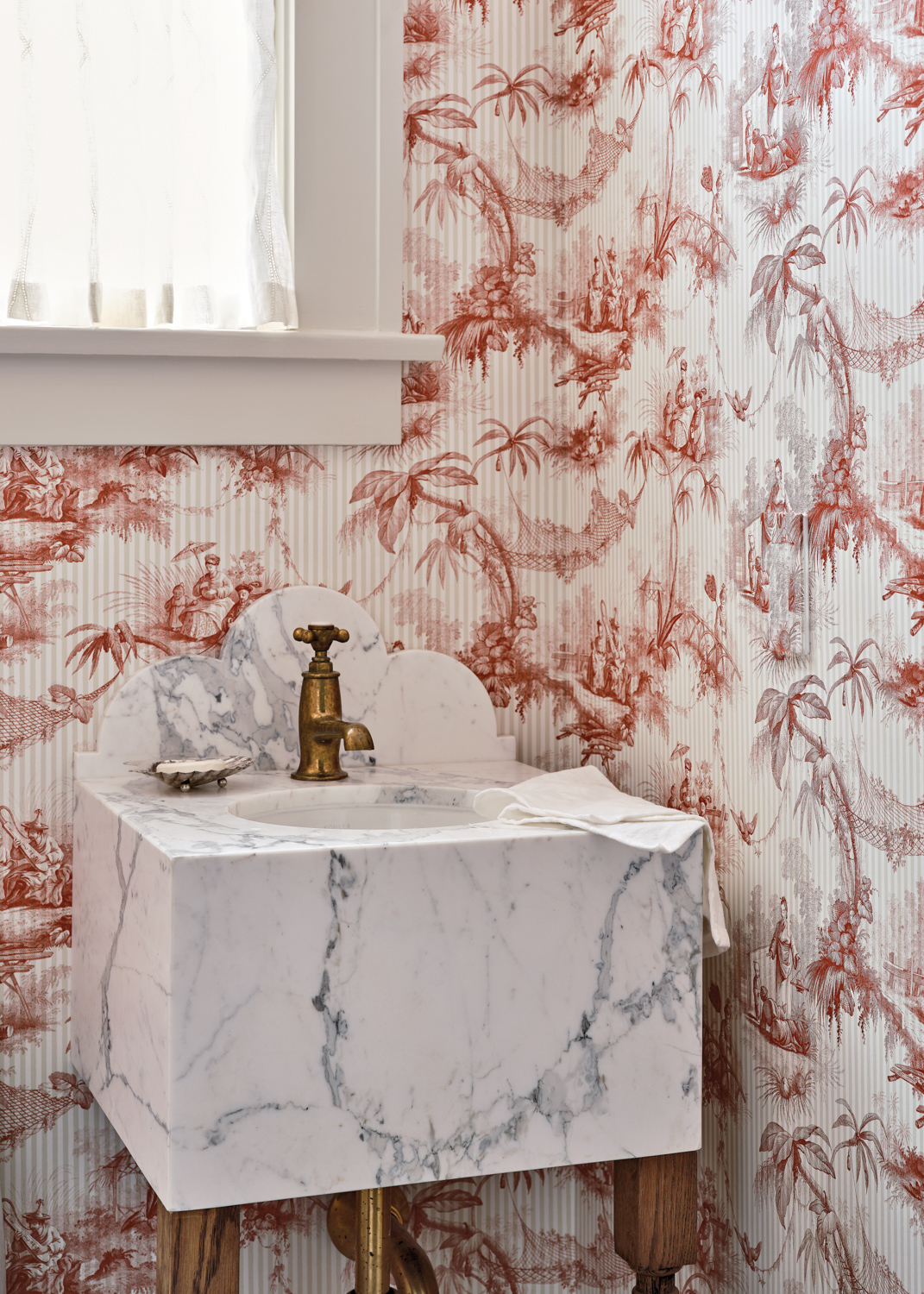petite powder room with patterned...