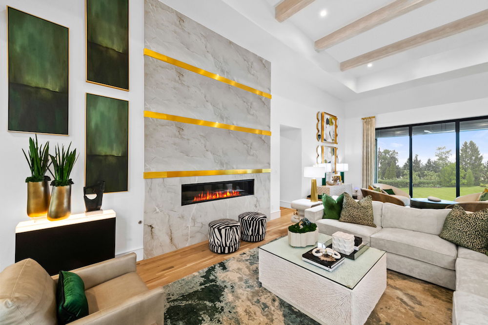 Fire place with gold shelf accents and stone wall.