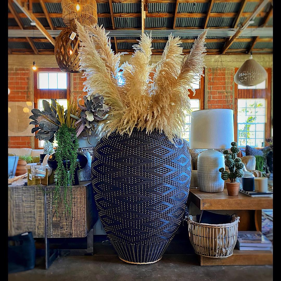 Vase with pampas grass adds a welcoming factor to any home.