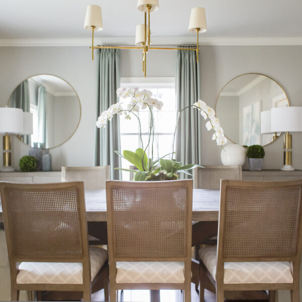 Creamy tones of soft blue and gray, a dash of pattern, and a few touches of gold make this dining room a sophisticated classic.