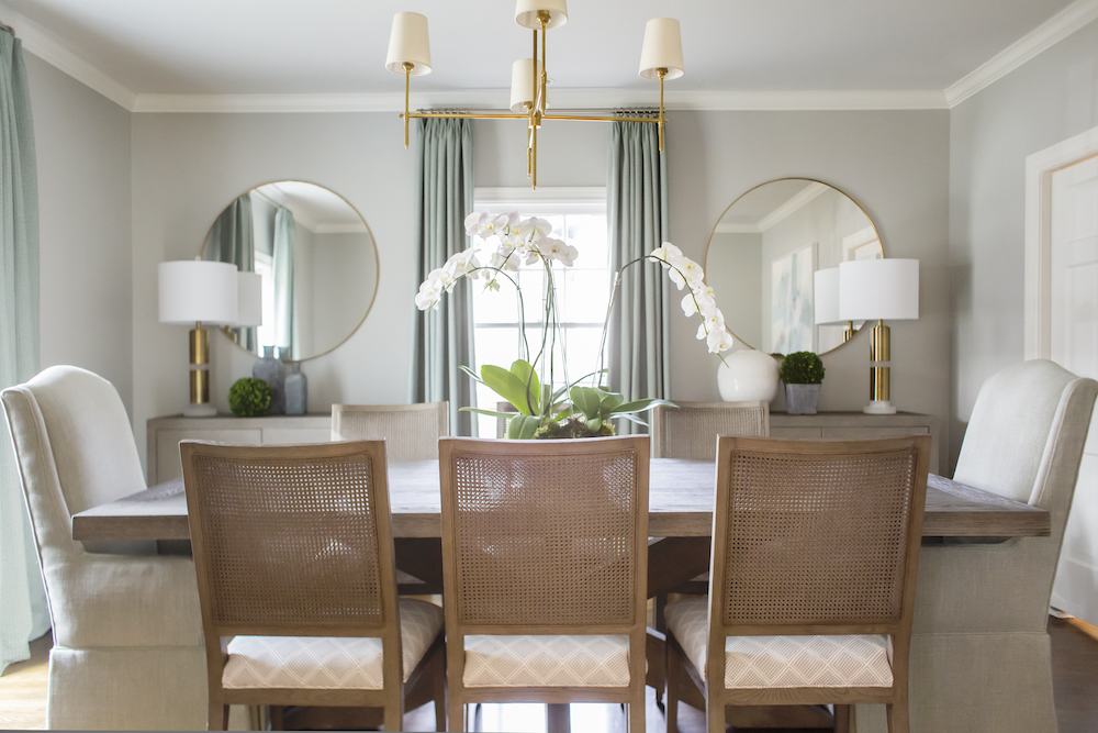 Creamy tones of soft blue and gray, a dash of pattern, and a few touches of gold make this dining room a sophisticated classic.