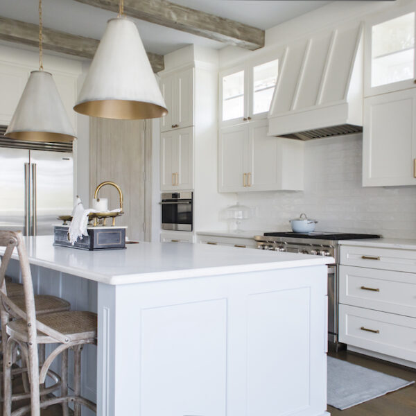 Coordinating wood tones and touches of dusty blue make for a stylish Country French inspired kitchen.