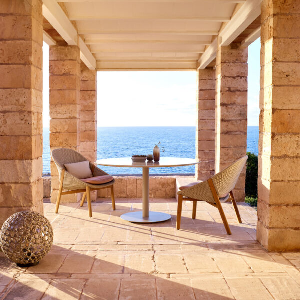 outdoor patio with modern wood table and chairs, outdoor furniture at coastal home by Studio471