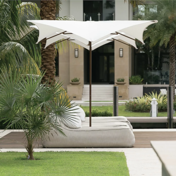 outdoor patio with modern white umbrella and luxury outdoor furniture in Los Angeles, California by Studio 471